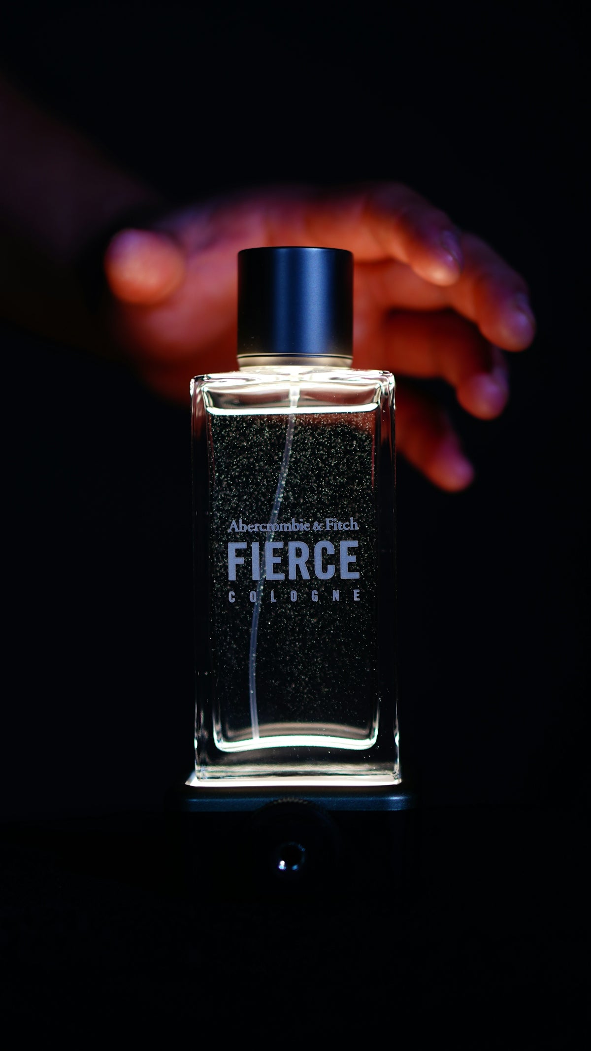 Abercrombie & fitch fierce cologne with a hand.